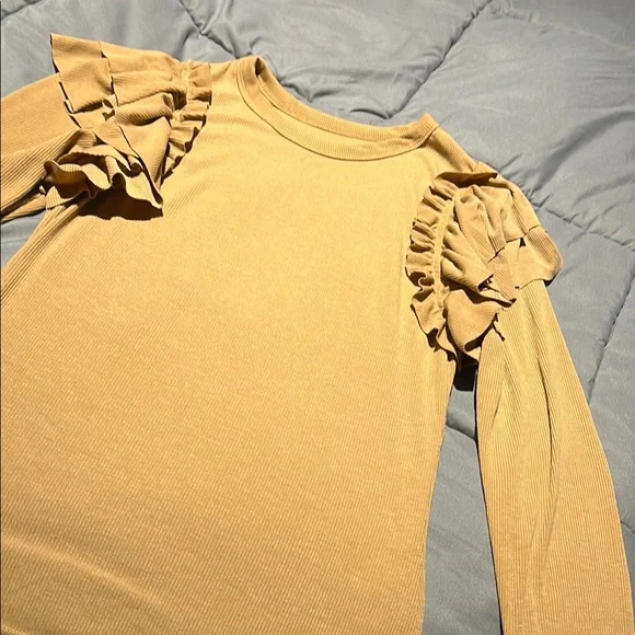 A tan blouse with ruffles on each side of shoulders - Picture 1 of 2